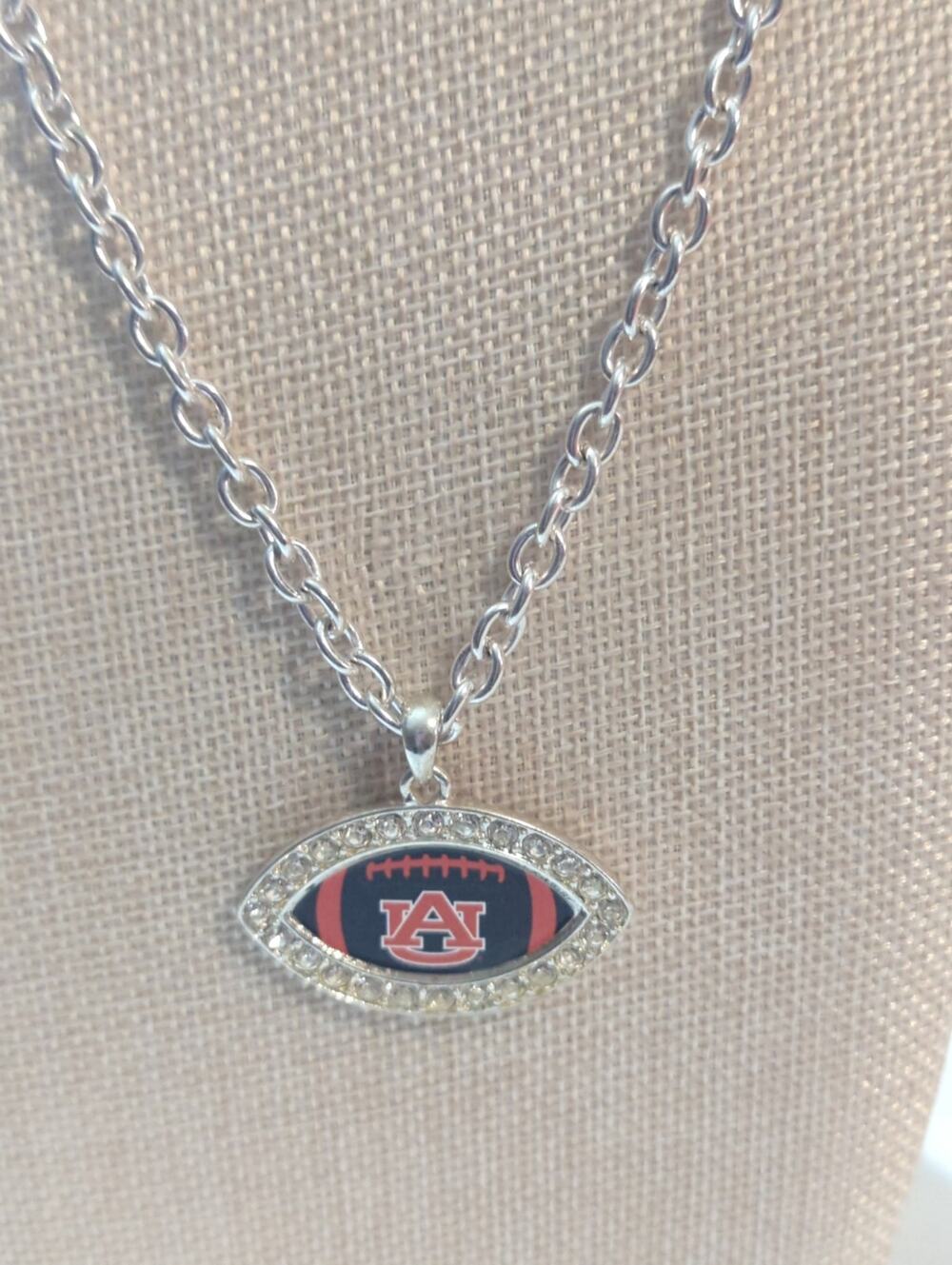 AU football shaped necklace.
